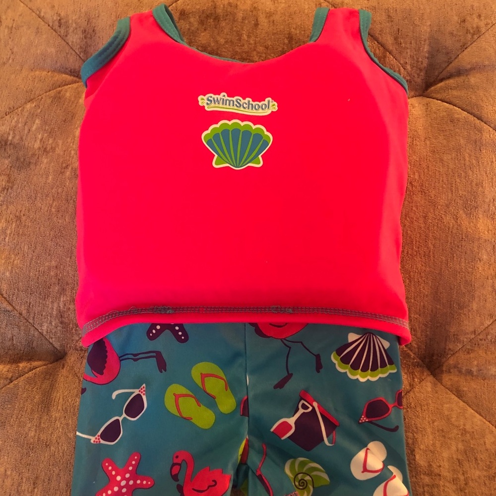 One piece swimwear with float attached